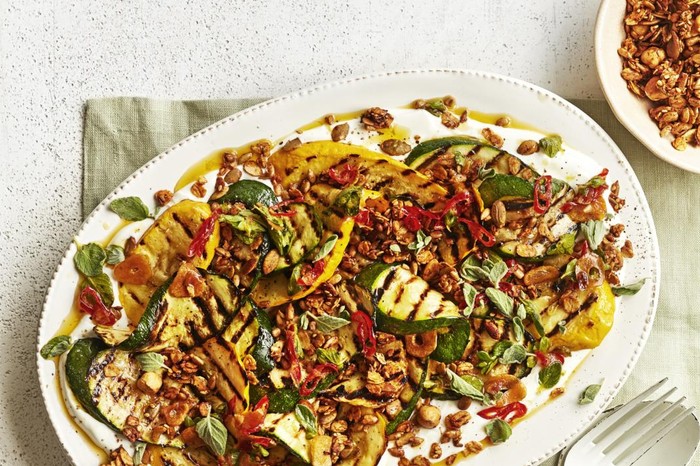 A platter of charred courgettes on a linen napkin