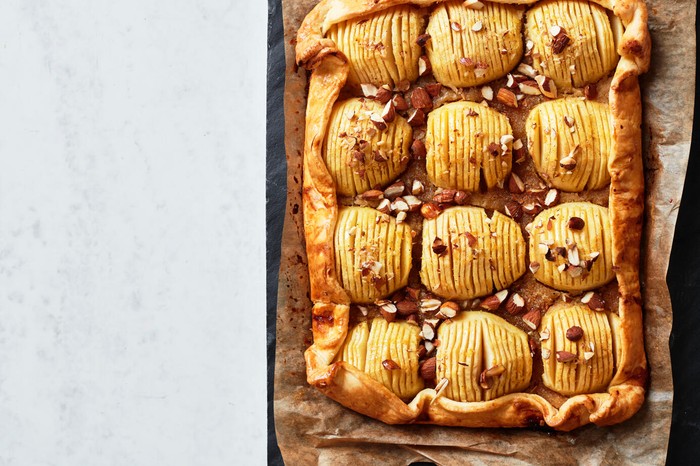 Apple and almond tart Square tart topped with sliced apples and walnuts