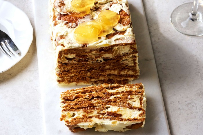 A rectangular fridge cake with one slice taken out of it