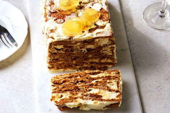 Three-ingredient ginger fridge cake A rectangular fridge cake with one slice taken out of it