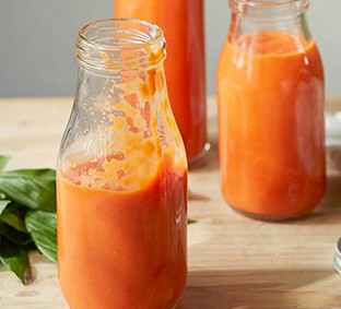 Three glass bottles of passata