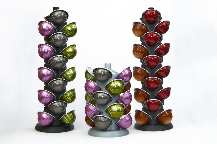 Three separate pod towers holding different coloured pods