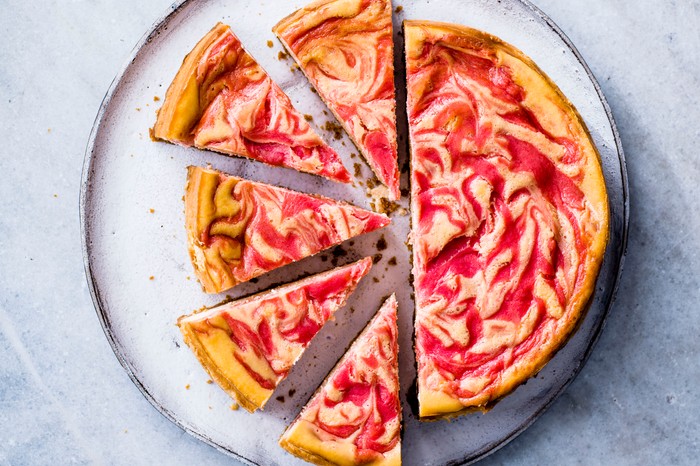 Baked Cheesecake with Rhubarb and Custard Baked Cheesecake with Rhubarb and Custard cut into slices