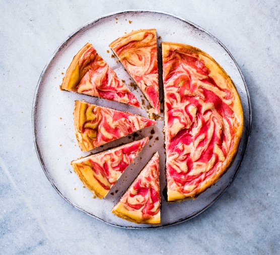 Baked Cheesecake with Rhubarb and Custard cut into slices