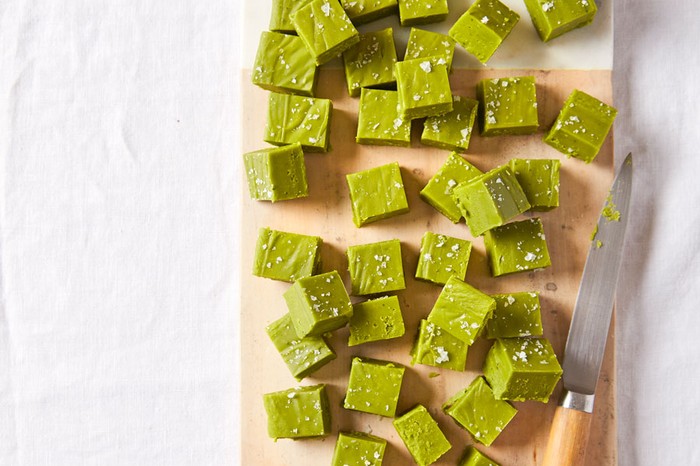 Green fudge on a board topped with salt