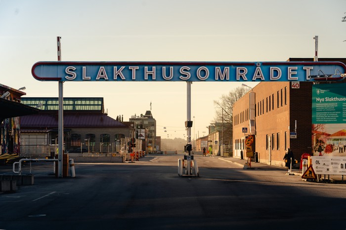 A sign saying Slakthusområdet in an old warehouse district in Stockholm