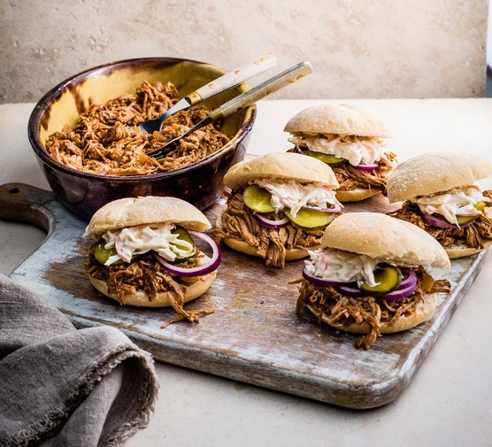 Slow cooker pulled port in rolls with pickles and slaw