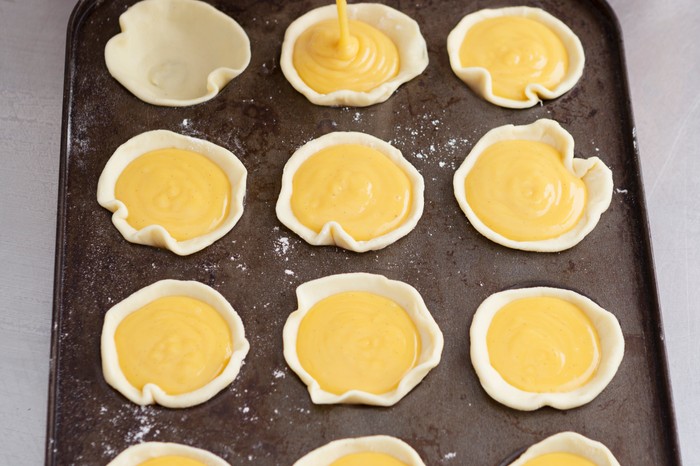 Pour custard into the tins