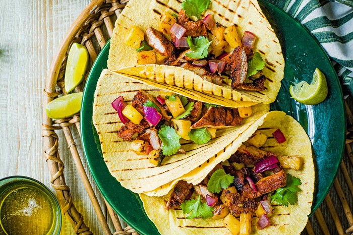 Tacos Al Pastor recipe containing pork, pineapple, onion and coriander