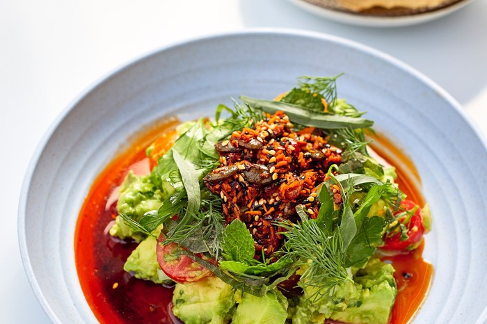 A bowl of red guacamole