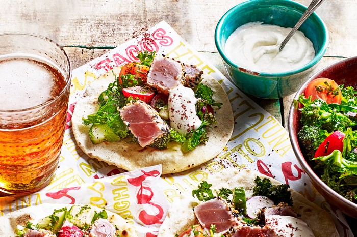 Tuna tacos with salad and a small bowl of yogurt