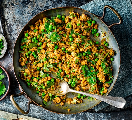 Large pan of turkey keema curry with a spoon