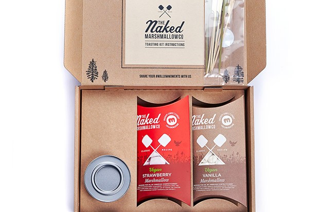 A brown paper box with two packets of vegan marshmallows in