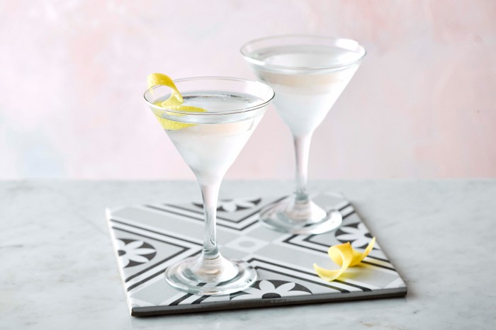 Vesper Martini Recipe Two martini glasses on a tile