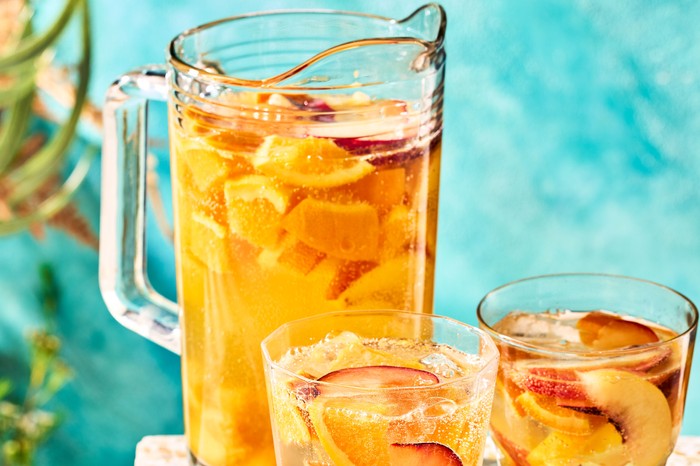 White sangria in pitcher and glasses