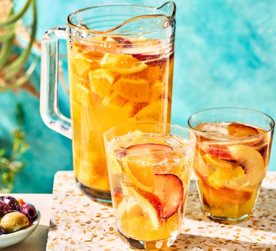 White sangria in pitcher and glasses