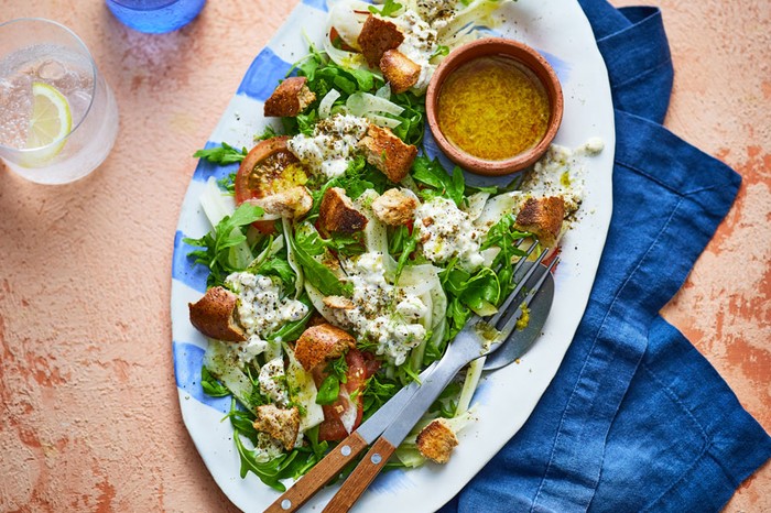 Platter of cottage cheese salad with a dip in a ramekin