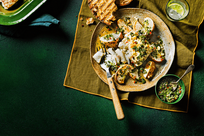 baked fish roasted turnips feta chimichurri in a round serving dish