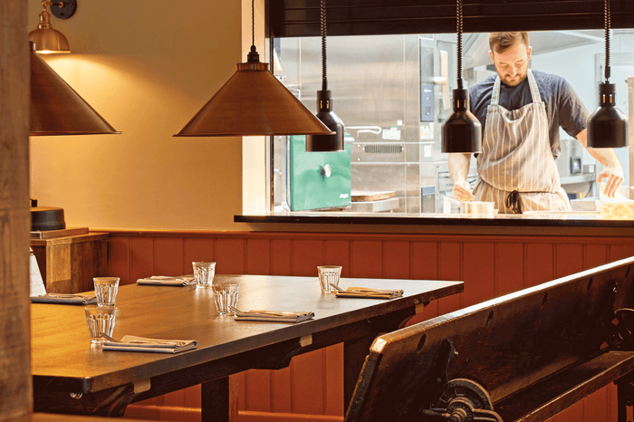 Interior of the dining room of the Harcourt Arms and into the kitchen