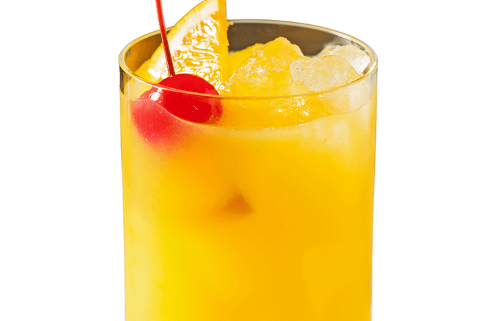 Harvey wallbanger cocktail with a cherry and slice of orange