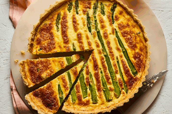 Quiche with asparagus and two slices cut out