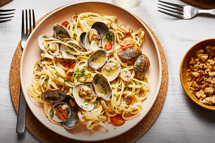 Linguine with clams and chilli in a bowl with a fork on the side