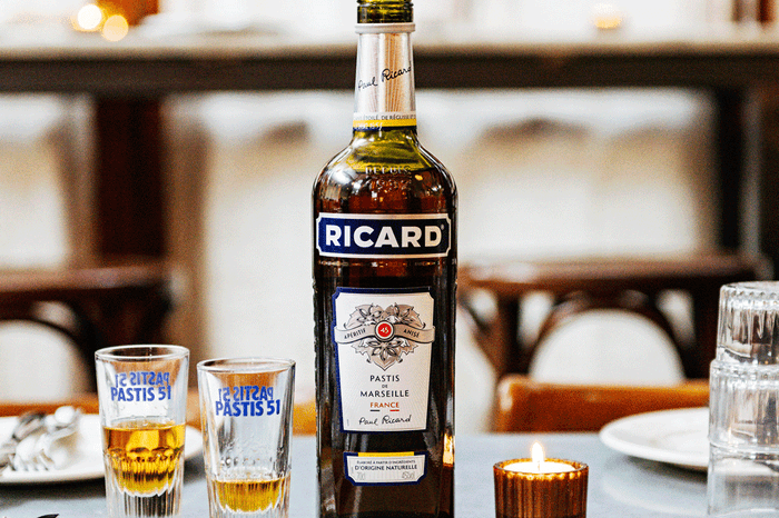 Pastis Bottle of pastis with shot glasses next to it