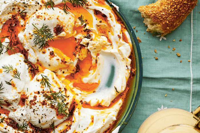 Turkish poached eggs swirled into yogurt on a plate